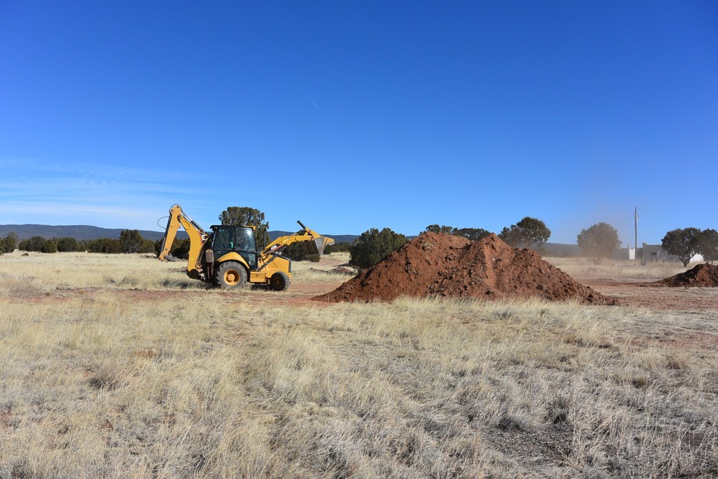 They are stockpiling dirt to use as a mounding system for the septic field.
